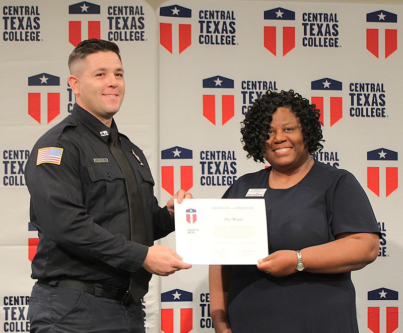 Copperas Cove resident Don Woods receives his paramedic certificate from CTC Vice Chancellor Dr. Tamara Clunis.