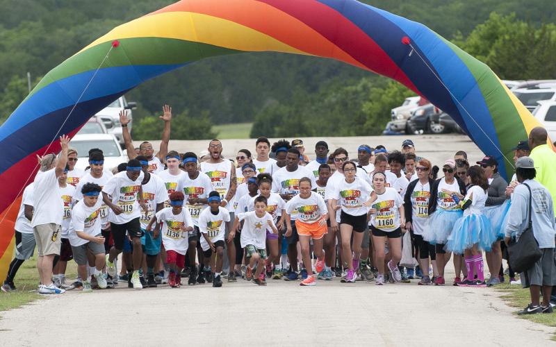 File Photo - Runners take off at the start of the annual Mayfest 5K. This year's event is set for Saturday, May 2, at Ogletree Gap Park.