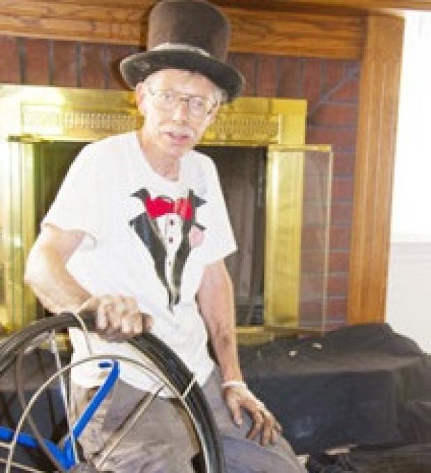 Doug Ables of Ables Top Hat Chimney Sweepers prepares to clean out a Copperas Cove home owners chimney box.