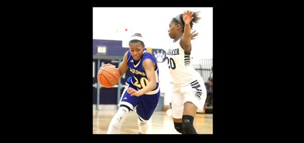 CCLP/TJ MAXWELL - Cove senior Keturah Taylor drives against Shoemaker’s Shadazia Birchette during Friday’s game at Shoemaker.