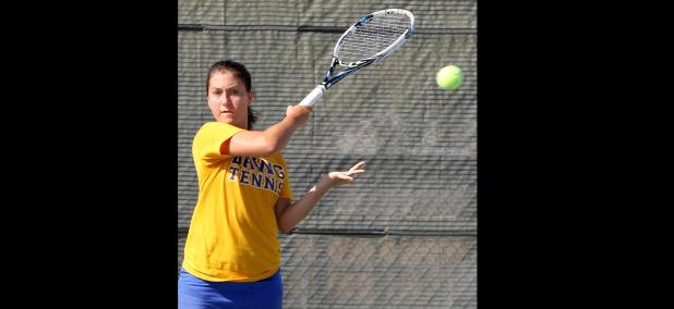 CCLP/TJ MAXWELL - Cove senior Tessa Bliss hits a forehand return earlier in the year. Dawg Tennis improved to 17-5 on the season with a 3-1 weekend.