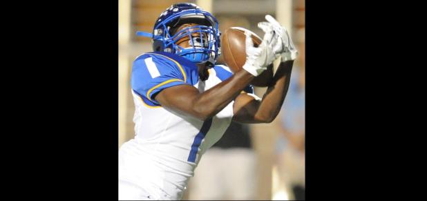 CCLP/LEE LETZER - Cove senior Isaiah McGriff hauls in a 54-yard touchdown pass to give Cove a 17-14 lead in the second quarter against Midway on Friday. The Dawgs eventually fell 48-24.