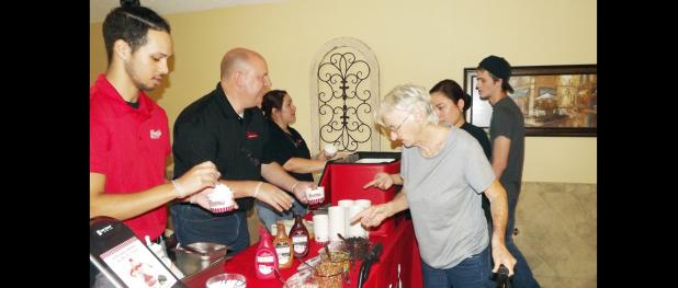 CCLP/PAMELA GRANT - Copperas Cove Nursing & Rehabilitation residents and staff enjoy a free sundae bar on Thursday afternoon courtesy of Freddy’s Frozen Custard & Steakburgers.
