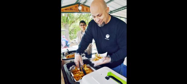 FILE PHOTO - Felix Alaniz, with Copperas Cove’s Knights of Columbus Council 6658, prepares a catfish plate at previous Spurfest.