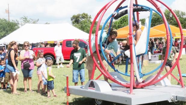 CCLP/BRITTANY FHOLER - One of the attractions at the 3rd Annual Holy Family Fall Fest was the Spaceball Gyroscope.