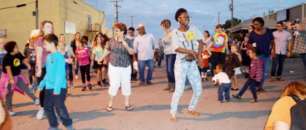 CCLP/LYNETTE SOWELL - Residents dance in the street during during Saturday night’s National Night Out Kickoff Party held in downtown Copperas Cove. The two-hour event had games, activities, door prizes, and food. The event is held annually prior to National Night Out.