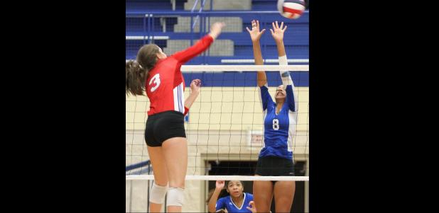 CCLP/TJ MAXWELL - Midway senior Allye Beth Deaton hits against Copperas Cove sophomore Aidan Chace during their match Friday in Waco. No. 1 state-ranked Midway (29-2, 5-0) swept the Lady Dawgs (23-12, 3-1) by a score of 25-5, 25-10, 25-7 to remain undefeated in District 8-6A action.