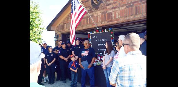 CCLP/LYNETTE SOWELL - Juniper Circle resident Chuck Holley gives a speech during a 9-11 remembrance gathering held at his home on Sunday afternoon, which was attended by neighbors along with Copperas Cove first responders.