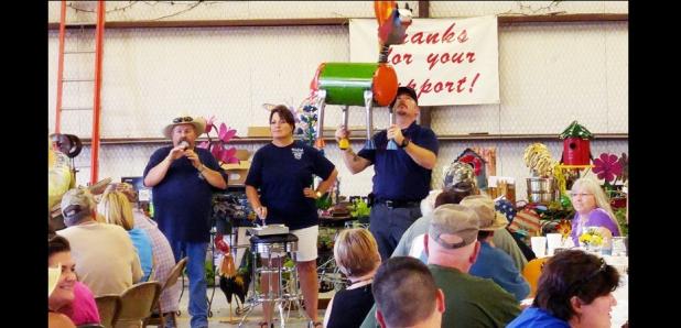 CCLP/LYNETTE SOWELL - Ricky Smith auctions off a sculpture during Saturday night’s annual fish fry at the Oakalla Volunteer Fire Department.