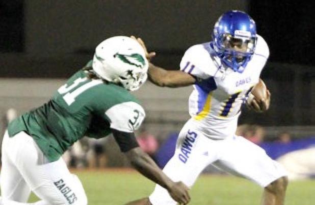 CCLP/TJ MAXWELL -- Copperas Cove junior running back Kylan Herrera stiff arms Ellison defender Isaiah Ivey during the first half of last Friday’s win in Killeen. Herrera and the Dawgs will face off with the Midway Panthers tonight.