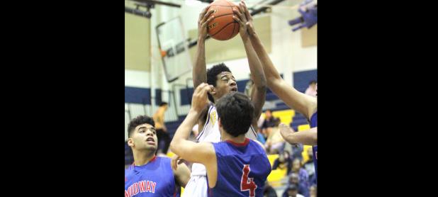 CCLP/TJ MAXWELL - Coperas Cove’s Quinton Ford shoots in traffic against Midway last year as a freshman. Ford is expected to make an impact as a sophomore for the 2016-2017 version of the Copperas Cove Bulldawgs.
