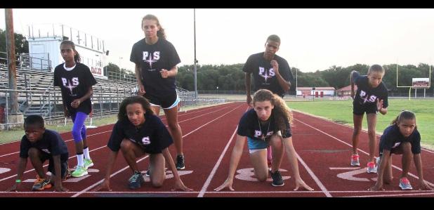 CCLP File Photo - The Centex Pacesetters pose for a picture during practice at Salado Junior High in preparation for this weekend’s Texas Amateur Athletic Federation State Track and Field Meet in McAllen. The Pacesetters are, left-to-right (front row): Jaylen Watson, Zoe Pearson, Jorja Washington and Abigail Mouton. Back row: Michaela Mouton, Brianna Washington, Reginald Mouton and Katelyn Mouton. They are coached by head coach Vincent Watson and assistant coaches Derwin Graham and Anthony James.