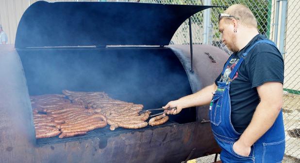 CCLP/FILE PHOTO - Grilled sausage was in high demand at Saturday’s Sausagefest held by Trinity Lutheran Church.
