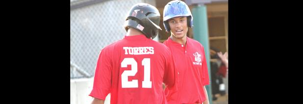 CCLP/TJ MAXWELL - Copperas Cove’s Michael Hays congratulates Harker Height’s Tyler Torres after Torres’ second RBI base hit during the inaugural Fellowship of Christian Athletes Victory Bowl Baseball Game Friday at the University of Mary Hardin-Baylor. Torres, Belton’s Trent Stafford and Hays hit consecutive RBI singles to give the Red Team a 5-1 lead in the fourth on their way to a 9-2 win.