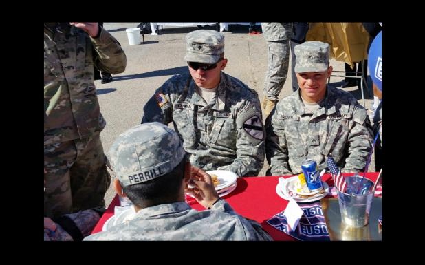 CCLP/CHUCK TAYLOR - Troops enjoy lunch at USO party last week.