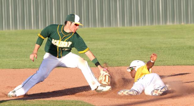 CCLP/TJ MAXWELL - Copperas Cove sophomore Michael Goudeau twists his body to avoid a tag as he stole second base in the Bulldawgs’ 13-3 blowout of Academy in the championship game of their host tournament Saturday at Bulldawg Field.