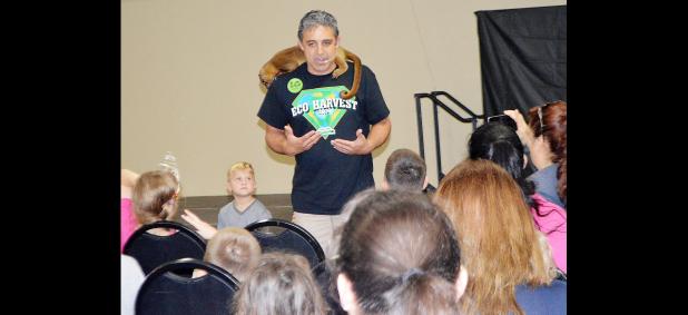 CCLP/BRITTANY FHOLER - Robert Trejo with Zoomagination talks about the kinkajou on his shoulders during Saturday’s 7th annual Eco Harvest festival.