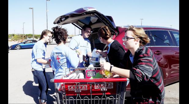 CCLP/PAMELA GRANT - Members of the St. Martin’s Episcopal Church gathering food and cleaning supplies to donate to the Soup Kitchen.