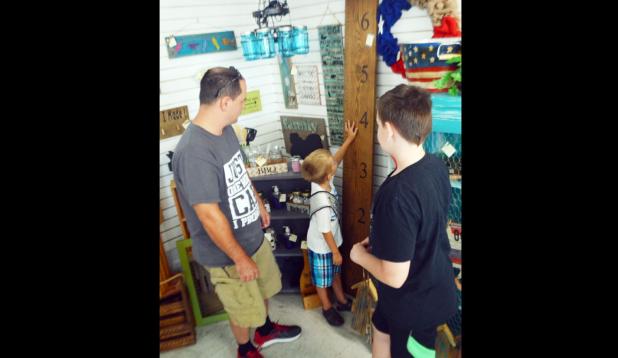 Customers browse the merchandise sold by various vendors at the grand opening for Decor & More on Saturday morning at 817 E. Business 190 at the former Giant Dollar location. – CCLP/LYNETTE SOWELL 
