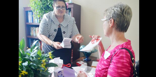 CCLP/LYNETTE SOWELL - Stephania Williams welcomes friends, family, clients and community supporters to the grand opening of Advocacy From the Heart at the Copperas Cove Entrepreneur Center on Thursday evening.