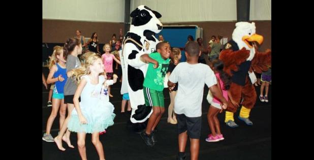 FILE PHOTO - Children and families gathered at a past National Dance Day to kick up their feet and learn some dance routines at GymKix.