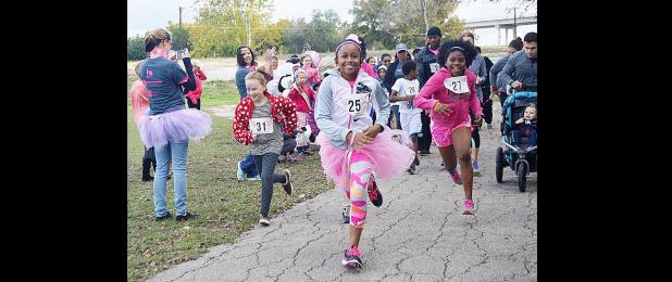 CCLP/FILE PHOTO - Pink Warrior Angels is holding its one-year celebration on Saturday along with a ribbon cutting as it joins the Copperas Cove Chamber of Commerce. Among the events it has held in the last year was the Pink Warrior Dash 5K, which drew approximately 100 runners and walkers to South Park.