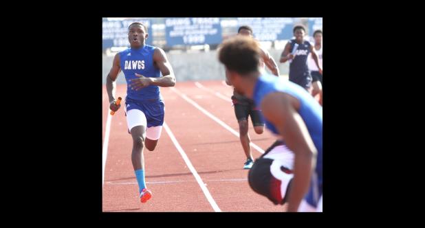 CCLP/TJ MAXWELL - Shamad Lomax closes in on Kylan Herrera during last year’s Bulldawg Relays. The duo helped lead the 4x100- and 4x200-meter relay teams to first- and second-place finishes Saturday at the Waco ISD Invitational in Waco. Cove hosts the Bulldawg Relays this Saturday.
