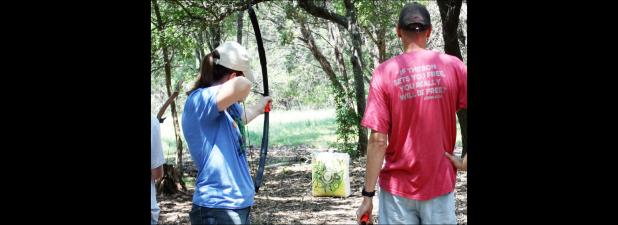 CCLP/KATHLEEN STARLING - Participants in PAR Guns archery class Saturday take aim with survival bows at archery block targets.