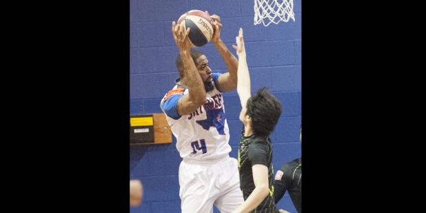 CCLP/DAVID MORRIS - Terence Dill of the Texas Sky Riders ABA basketball team hauls in a rebound against the Shizuoka Gymrats Friday at Camp Triumph in Copperas Cove.