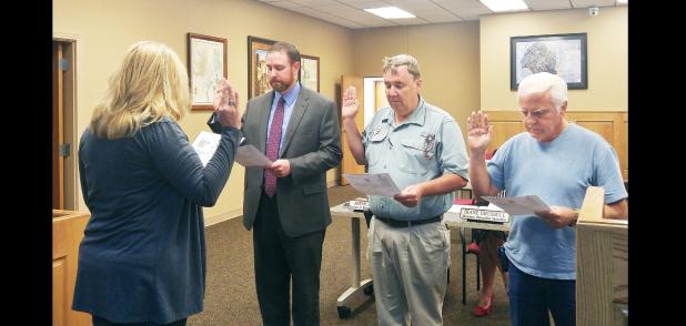 CCLP/LYNETTE SOWELL - Adam Martin, Christian Mulvey and Harald Weldon are sworn in by Bradi Diaz as the newest board members of the Copperas Cove Economic Development Corporation at the EDC’s monthly meeting on Tuesday. The three newly appointed board members join Marc Payne and Annabelle Smith on the board.