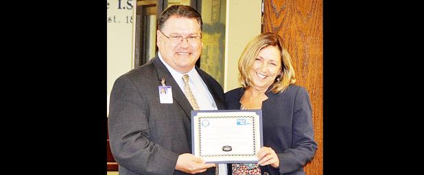 COURTESY PHOTO - S. C. Lee Junior High Principal Kayleen Love accepts the United Way Year-Over-Year Increase award on behalf of her campus representative Shannon Thompson. Under Thompson’s leadership, the campus increased its fundraising total by more than 160 percent over 2015’s total