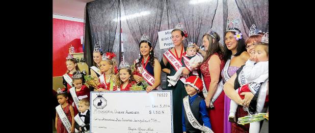 CCLP/BRITTANY FHOLER - The Rabbit Fest Royalty and the newly crowned Krist Kindl Royalty pose with a check with the amount raised for Mitochondrial Disease awareness at the 2nd annual Miss Krist Kindl Charity Pageant held in Bearables in downtown Copperas Cove Saturday morning.