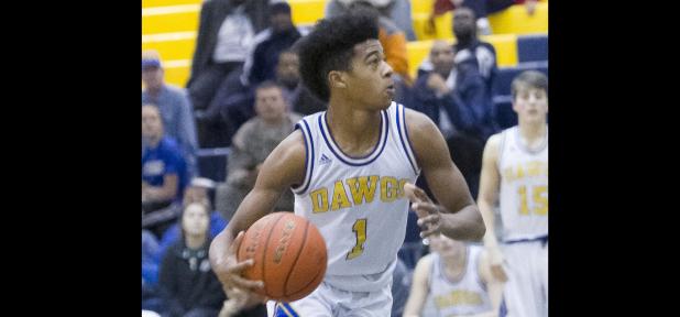 CCLP/TJ MAXWELL - Cove sophomore Quinton Ford drives to the basket during the Dawg Pound Showdown last weekend. Ford scored a team-high 19 points, including 12 in the first period, in Monday’s 66-51 loss to the Temple Wildcats.