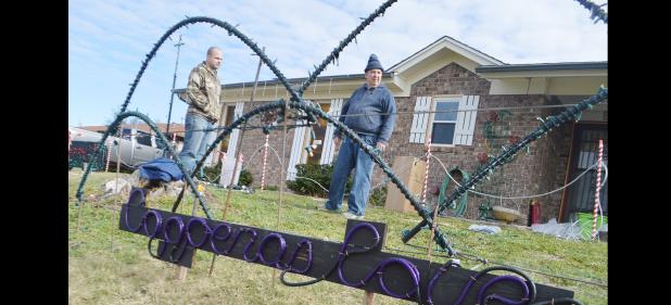 CCLP/LYNETTE SOWELL - Christian Mulvey plans out the light display with his son-in-law Dustin Phipps on Friday afternoon. Mulvey will have his 3rd annual light show set to music at 1605 Little Ave. 7-10 p.m. nightly from Dec. 15-31. Mulvey has a facebook page for his display facebook.com/lightsofchristmas