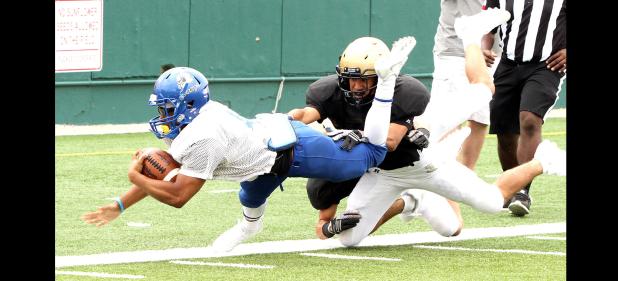 CCLP/TJ MAXWELL - Cove senior running back Jaylon Hana dives for the end zone during the controlled scrimmage portion of the Bulldawgs’ scrimmage against Abilene at Shotwell Stadium in Abilene on Friday. The Bulldawgs open up the regular season at home against A&M Consolidated on Friday.
