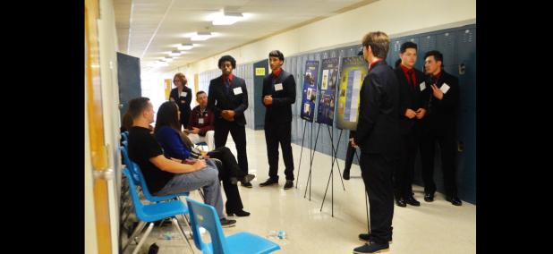 CCLP/LYNETTE SOWELL - A student team practices their presentation in a hallway at CCHS during the DECA Region V district conference held Saturday. Nearly 1,000 students came from 26 area high schools to compete for a shot to advance to the state competition in San Antonio.