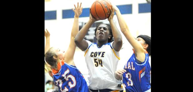 CCLP/LEE LETZER - Copperas Cove senior Chyanne Chapman (54) shoots between San Angelo defenders Sydnie Gilbert (25) and Morgan Walker during the Lady Dawgs 57-48 win Friday at Bulldawg Gymnasium. Chapman registered a doubledouble with 10 points and 10 rebounds in the win.
