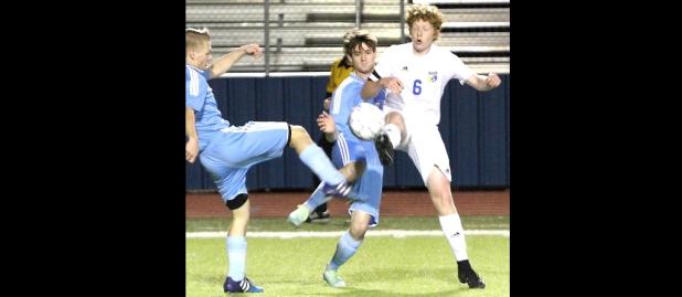 CCLP/TJ MAXWELL - Cove senior captain Billy Horton (6) battles for possession against China Spring on Tuesday.
