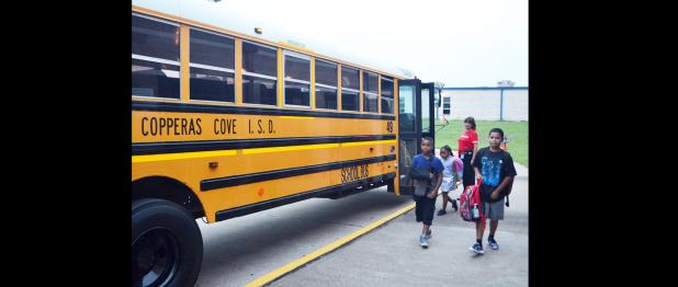 CCLP/TRAVIS MARTIN - Students return by the bus load to Clements Parsons Elementary School for the start of a new year.