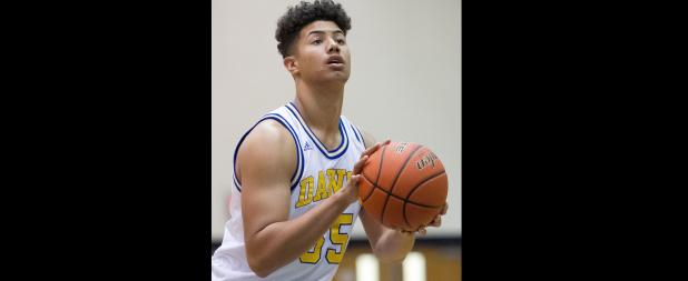 CCLP/TJ MAXWELL - Cove sophomore Tyrese Taylor shoots a free throw in the fourth quarter of the Bulldawgs’ 51-44 win over the Cedar Park Timberwolves Friday at Bulldawg Gymnasium. Taylor hit 4 for 4 free throws in the final 70 seconds to help Cove earn their first win.