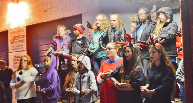 CCLP/LYNETTE SOWELL - The Copperas Cove Junior High School choir sings “Silent Night” in several languages and performs it using sign langugage on Friday night at Krist Kindl Markt in downtown Copperas Cove.