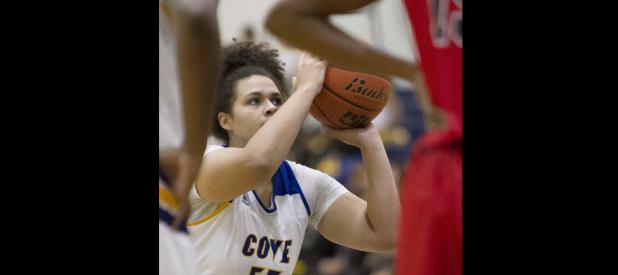 CCLP/TJ MAXWELL - Cove senior Kayla McCloud shoots a free throw in the third quarter of the Lady Dawgs’ 45-30 loss to the Lady Tigers in the District 8-6A opener Friday at Bulldawg Gymnasium.