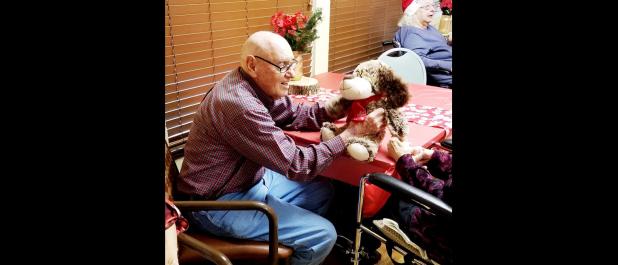 CCLP/PAMELA GRANT - Nursing home residents enjoy their Christmas gifts donated by the community of Copperas Cove.