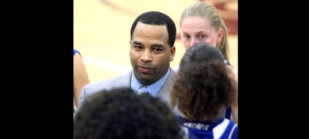 CCLP/TJ MAXWELL - Cove girls’ head basketball coach Eldridge McAdams talks to his team during district play last year. McAdams earned his 200th career win in the season opener against Leander.