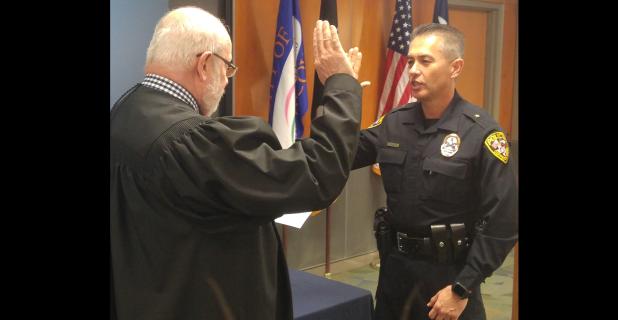 CCLP/LYNETTE SOWELL - Eddie Wilson takes the oath of office as he is sworn in as the chief of police Thursday morning.