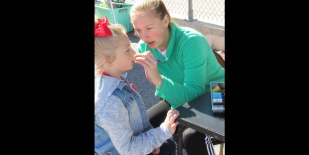 CCLP/BRITTANY FHOLER - Members of the High School United Teens Service Excel Club (HUTS) worked on face painting at the Relay for Life of Lampasas/Copperas Cove Tailgate Kick Off held Saturday at Bulldawg Stadium.