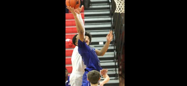 CCLP/TJ MAXWELL - Copperas Cove senior Dahmir Pearson scores on an ‘and 1’ opportunity to give the Bulldawgs a 44- 43 lead in the fourth quarter of their 49-43 win over Belton Friday in Belton. Cove outscored Belton 25-6 over the final 9:46 of game action to secure the win.