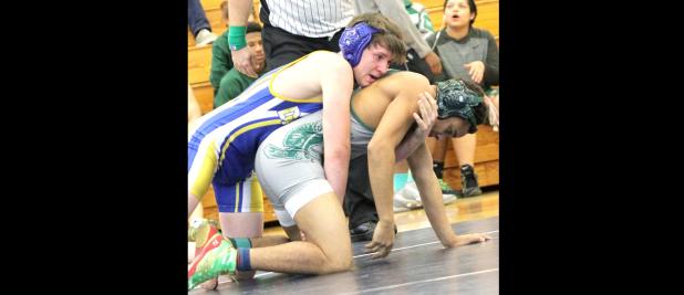 CCLP/file photo - Copperas Cove’s Damian Harmon, left, competes in the 2016 District 13-6A wrestling championships at Shoemaker High School. Harmon, who didn’t place in 2016, won gold at the 2017 13-6A meet this weekend in Austin. Harmon won three-consecutive matches in the 145-pound division to earn the gold medal.