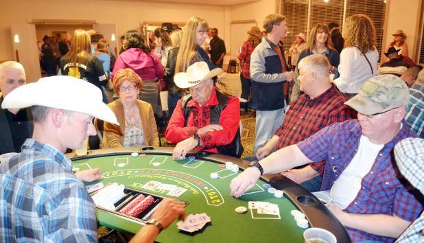 CCLP/TRAVIS MARTIN - Blackjack tables were full at the Annual Wild West Night hosted by the Fort Hood Spouses’ Club on Friday night at Club Hood. The annual fundraising event held live and silent auctions to help bring in proceeds to help the local communities through scholarships and grants.