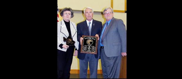 CCLP/PAMELA GRANT - Sherry Hoffpauir and Joe Lombardi were selected as the recipients for the Spirit of the Greater Fort Hood Area United Way award, Thursday during the annual luncheon. Presenting the award is Central Texas College Chancellor Jim Yeonopolus.
